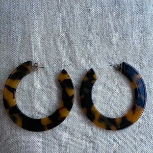 Acrylic cheetah print hoop earrings. 2 1/4’ diameter